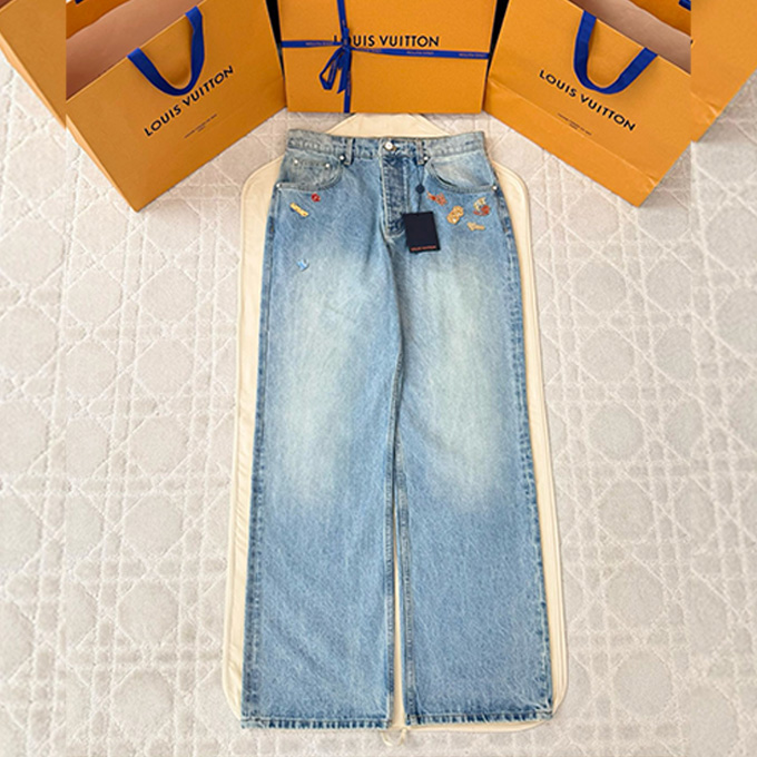 lv louis vuitton badge decorated washed denim pants